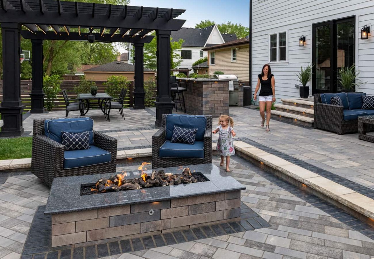 Back Yard Patio and Gas Fire Pit Made with Unilock Pavers and Wall Block