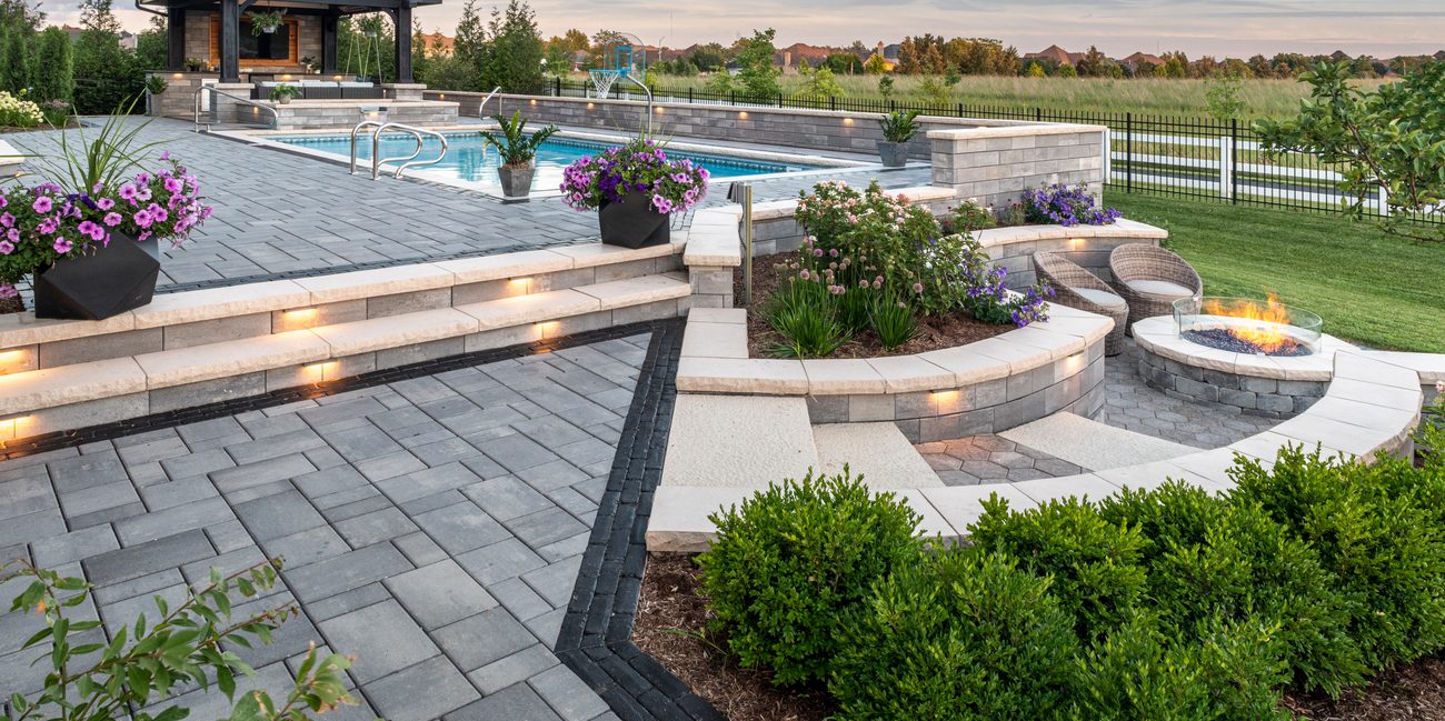 Custom Outdoor Living Space with Unilock Pavers and Wall Block